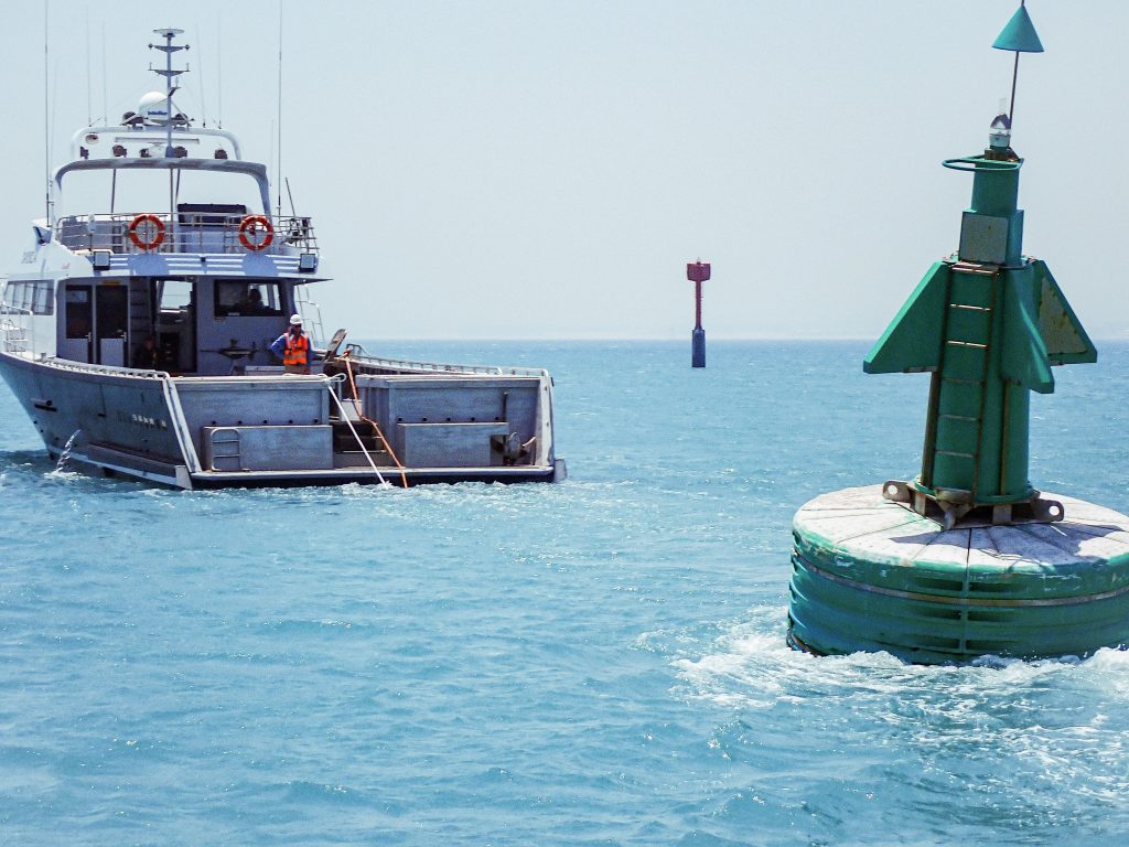 Franmarine Dive support vessel, Daybreak, towing a navigational aid out through the shipping channel in the Port of Geraldton
