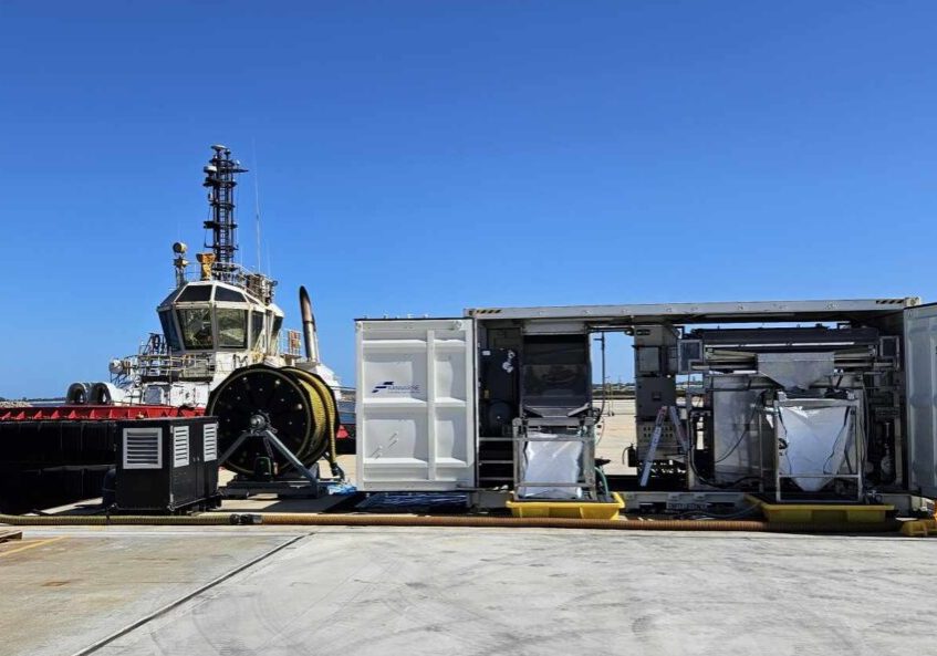 a shipping container on a dock rigged out as a Franmarine workspace